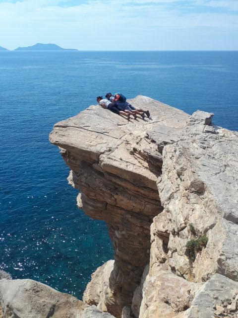 a couple looking from the cliff